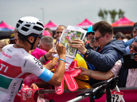 Mirco Maestri of Italy and Team Polti Kometa signing autographs to fans prior to the 107th Giro d'Italia 2024, Stage 12, a 193km stage from...