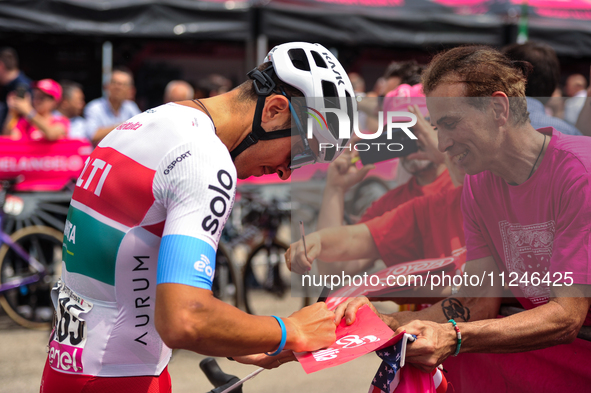 Mirco Maestri of Italy and Team Polti Kometa signing autographs to fans prior to the 107th Giro d'Italia 2024, Stage 12, a 193km stage from...