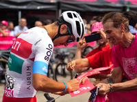 Mirco Maestri of Italy and Team Polti Kometa signing autographs to fans prior to the 107th Giro d'Italia 2024, Stage 12, a 193km stage from...