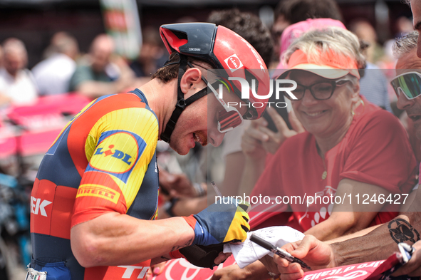 Simone Consonni of Italy and Team Lidl - Trek signing autographs to fans prior to the 107th Giro d'Italia 2024, Stage 12, a 193km stage from...