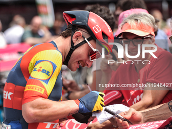 Simone Consonni of Italy and Team Lidl - Trek signing autographs to fans prior to the 107th Giro d'Italia 2024, Stage 12, a 193km stage from...