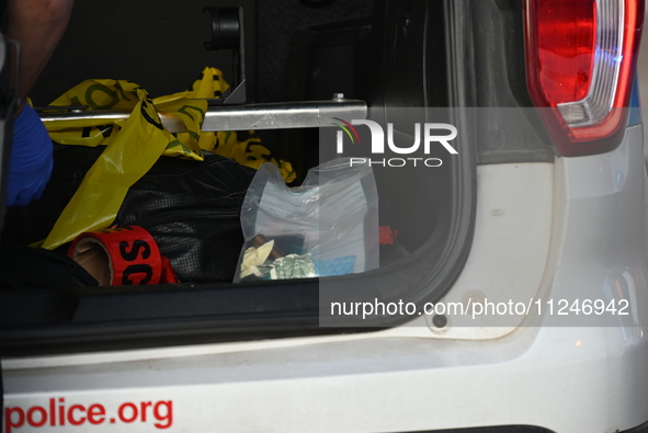 Evidence is being collected from the crime scene and placed in the back of a Chicago police car. A 31-year-old male is in critical condition...