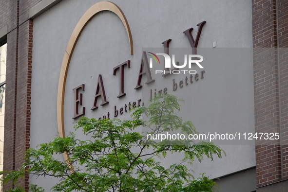 The Eataly storefront signage is showing a large police presence after an assault at Eataly Italian Restaurant in Chicago, Illinois, United...