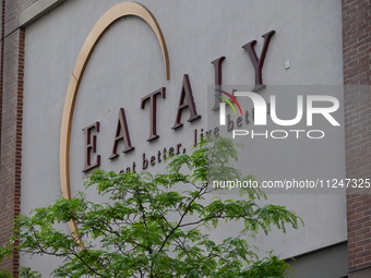 The Eataly storefront signage is showing a large police presence after an assault at Eataly Italian Restaurant in Chicago, Illinois, United...