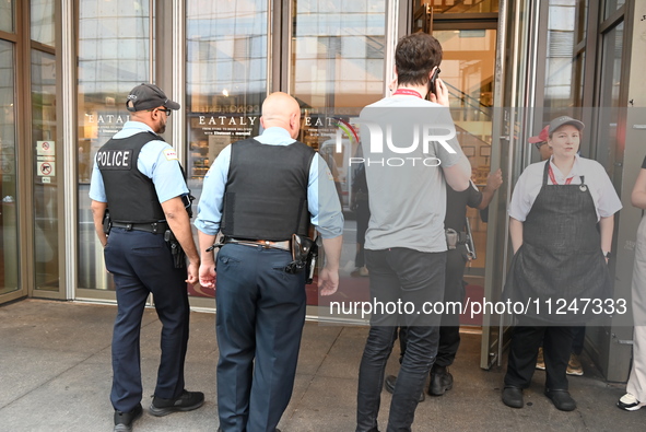 Police officers are entering Eataly. A large police presence is occurring after an assault at Eataly Italian Restaurant in Chicago, Illinois...