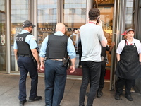 Police officers are entering Eataly. A large police presence is occurring after an assault at Eataly Italian Restaurant in Chicago, Illinois...