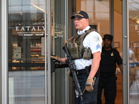 A police officer is exiting Eataly with a weapon. There is a large police presence after an assault at Eataly Italian Restaurant in Chicago,...