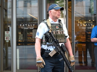 A police officer is exiting Eataly with a weapon. There is a large police presence after an assault at Eataly Italian Restaurant in Chicago,...