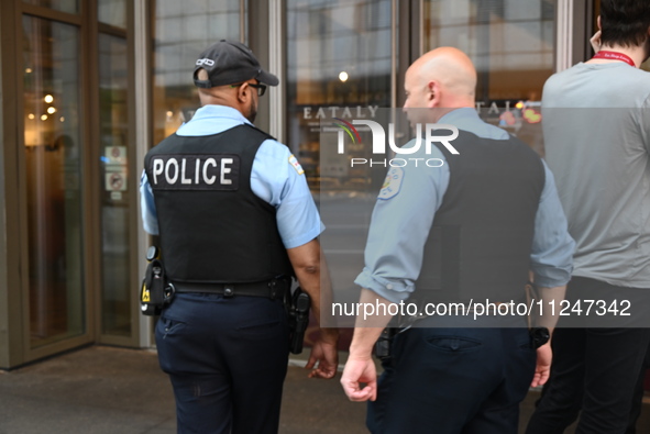 Police officers are entering Eataly. A large police presence is occurring after an assault at Eataly Italian Restaurant in Chicago, Illinois...