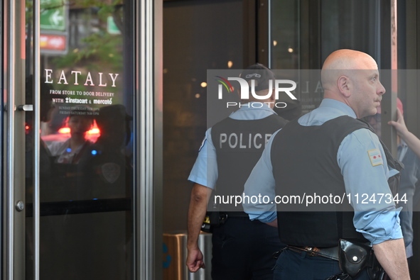 Police officers are entering Eataly. A large police presence is occurring after an assault at Eataly Italian Restaurant in Chicago, Illinois...