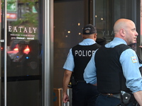 Police officers are entering Eataly. A large police presence is occurring after an assault at Eataly Italian Restaurant in Chicago, Illinois...