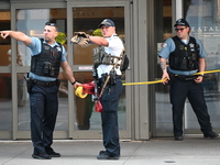 Police officers are taping off the front entrance to Eataly. There is a large police presence after an assault at Eataly Italian Restaurant...