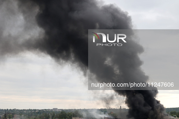 A pillar of smoke is rising over the city after the shelling of Russian troops in Kharkiv, Ukraine, on May 17, 2024. NO USE RUSSIA. NO USE B...