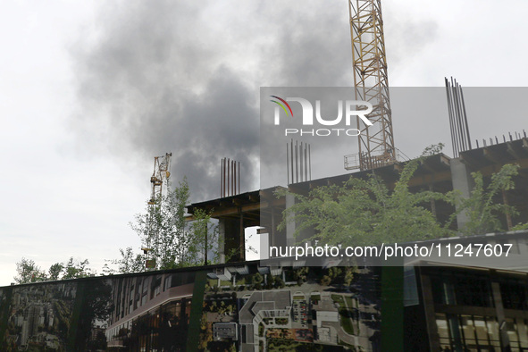 A pillar of smoke is rising over the city after the shelling of Russian troops in Kharkiv, Ukraine, on May 17, 2024. NO USE RUSSIA. NO USE B...