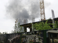 A pillar of smoke is rising over the city after the shelling of Russian troops in Kharkiv, Ukraine, on May 17, 2024. NO USE RUSSIA. NO USE B...