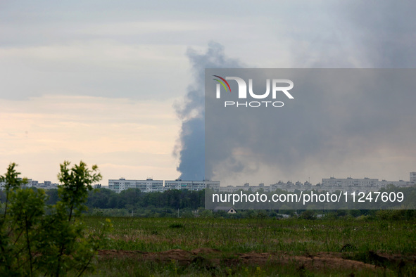 A pillar of smoke is rising from behind apartment blocks after the shelling of Russian troops in Kharkiv, Ukraine, on May 17, 2024. NO USE R...