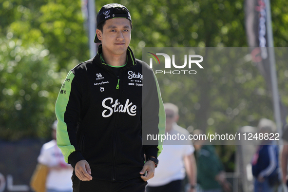 Zhou Guanyu of China and Kick Sauber C44 Ferrari are arriving at the circuit prior to the Free Practice of the Formula 1 Gran Premio del Mad...