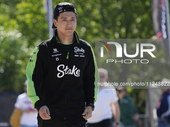 Zhou Guanyu of China and Kick Sauber C44 Ferrari are arriving at the circuit prior to the Free Practice of the Formula 1 Gran Premio del Mad...