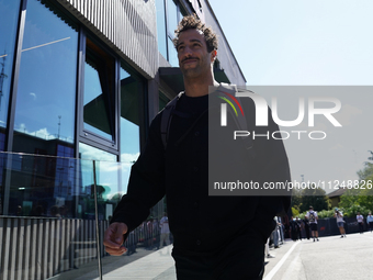 Daniel Ricciardo of Australia and Visa Cash App RB VCARB 01 are arriving at the circuit prior to the Free Practice of the Formula 1 Gran Pre...