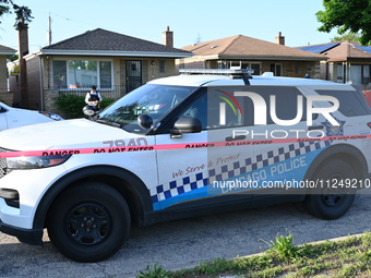 A police vehicle is in front of the home where the homicide is occurring. A 54-year-old male victim is being shot in the chest and killed wh...