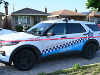 A police vehicle is in front of the home where the homicide is occurring. A 54-year-old male victim is being shot in the chest and killed wh...