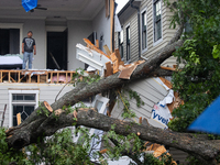 A man is looking out from inside a destroyed home in the Houston Heights at Ashland St. and 27th St. in Houston, United States, on May 17, 2...