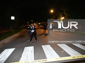 Evidence markers are being placed on the ground where shell casings are being discovered at the crime scene. Three people are being shot in...