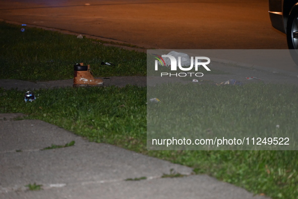 Police are finding the belongings of the victim at the crime scene. A male victim is being shot in Chicago, Illinois, United States, on May...