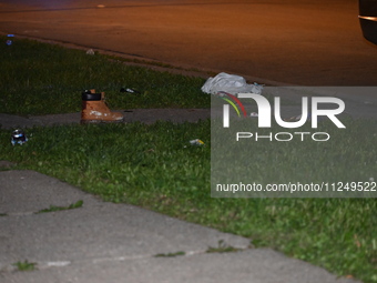 Police are finding the belongings of the victim at the crime scene. A male victim is being shot in Chicago, Illinois, United States, on May...