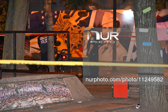 Police tape is blocking off the area of the crime scene. An unidentified male victim is being fatally stabbed in Chicago, Illinois, United S...