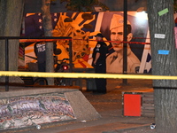 Police tape is blocking off the area of the crime scene. An unidentified male victim is being fatally stabbed in Chicago, Illinois, United S...