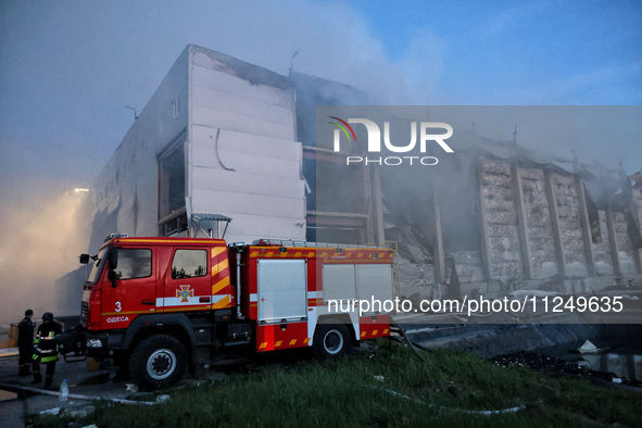 Rescuers are working at a civil enterprise damaged by a Russian missile attack in Odesa, Ukraine, on May 17, 2024. 