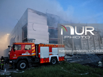 Rescuers are working at a civil enterprise damaged by a Russian missile attack in Odesa, Ukraine, on May 17, 2024. (