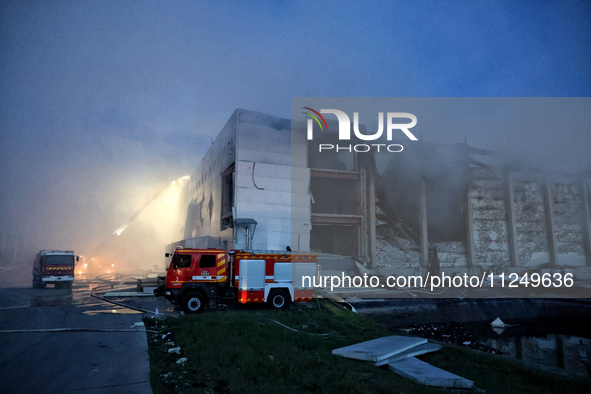 Rescuers are working at a civil enterprise damaged by a Russian missile attack in Odesa, Ukraine, on May 17, 2024. 