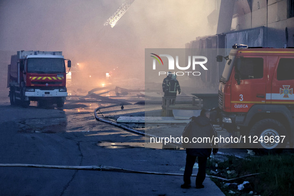 Rescuers are working at a civil enterprise damaged by a Russian missile attack in Odesa, Ukraine, on May 17, 2024. 