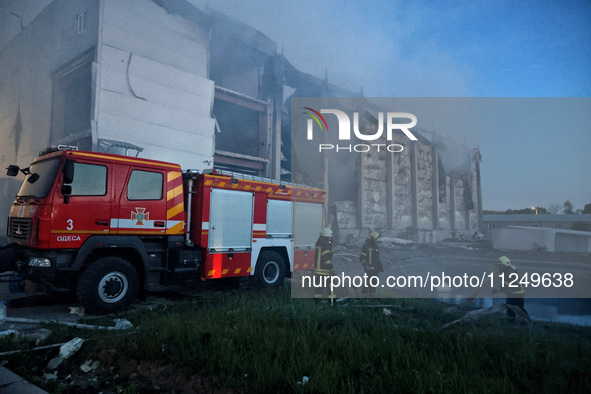 Rescuers are working at a civil enterprise damaged by a Russian missile attack in Odesa, Ukraine, on May 17, 2024. 