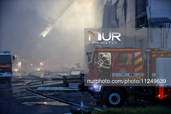 Rescuers are working at a civil enterprise damaged by a Russian missile attack in Odesa, Ukraine, on May 17, 2024. 