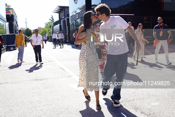 Charles Leclerc of Monaco and Ferrari SF-24 is kissing his girlfriend in the paddock prior to the Qualify of the Formula 1 Gran Premio of th...