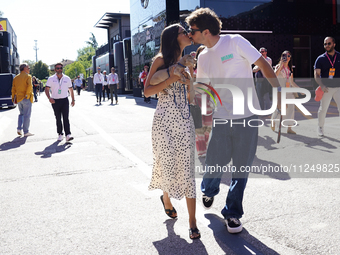 Charles Leclerc of Monaco and Ferrari SF-24 is kissing his girlfriend in the paddock prior to the Qualify of the Formula 1 Gran Premio of th...