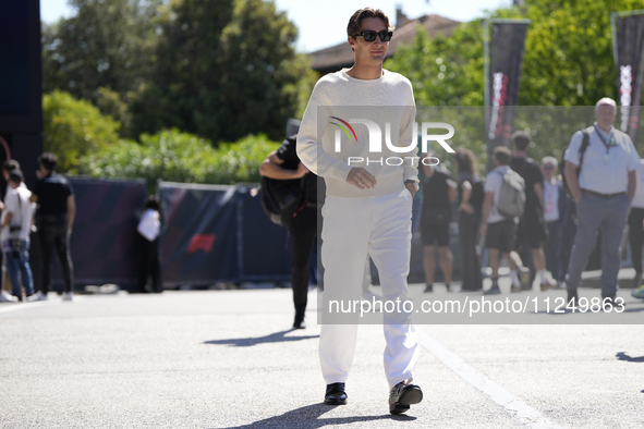 George Russell of England and the Mercedes AMG Petronas F1 Team W15 are walking in the paddock prior to the Qualify of the Formula 1 Gran Pr...