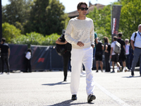 George Russell of England and the Mercedes AMG Petronas F1 Team W15 are walking in the paddock prior to the Qualify of the Formula 1 Gran Pr...