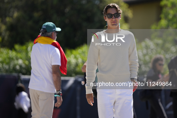 George Russell of England and the Mercedes AMG Petronas F1 Team W15 are walking in the paddock prior to the Qualify of the Formula 1 Gran Pr...