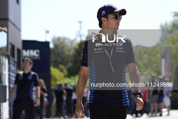 Sergio Perez of Mexico and Oracle Red Bull Racing RB20 are walking on the paddock prior to the Qualify of the Formula 1 Gran Premio of the M...