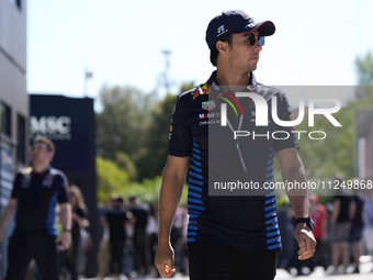 Sergio Perez of Mexico and Oracle Red Bull Racing RB20 are walking on the paddock prior to the Qualify of the Formula 1 Gran Premio of the M...