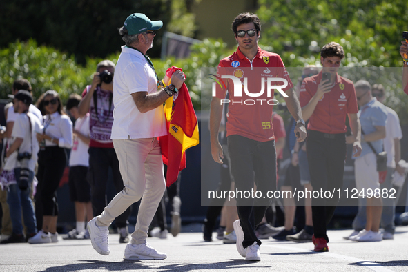 Carlos Sainz of Spain and Ferrari SF-24 are walking on the paddock prior to the Qualify of the Formula 1 Gran Premio of the Made in Italy an...