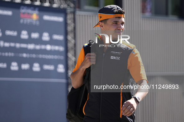 Lando Norris of England and McLaren MCL38 Mercedes are walking in the paddock prior to the Qualify of the Formula 1 Gran Premio of the Made...