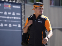 Lando Norris of England and McLaren MCL38 Mercedes are walking in the paddock prior to the Qualify of the Formula 1 Gran Premio of the Made...