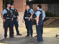 Police officers are gathering at the crime scene where the male victim is shot. A 42-year-old male victim is wounded in Chicago, Illinois, U...