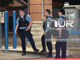 Police officers are gathering at the crime scene where the male victim is shot. A 42-year-old male victim is wounded in Chicago, Illinois, U...