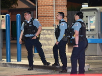 Police officers are gathering at the crime scene where the male victim is shot. A 42-year-old male victim is wounded in Chicago, Illinois, U...